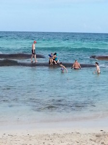 Sand Bags In Front of Beach - Ocean is Shallow Enough to Walk to These